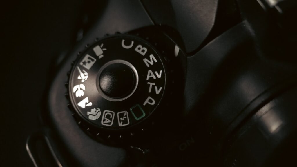 Close-up of a camera's mode dial and settings