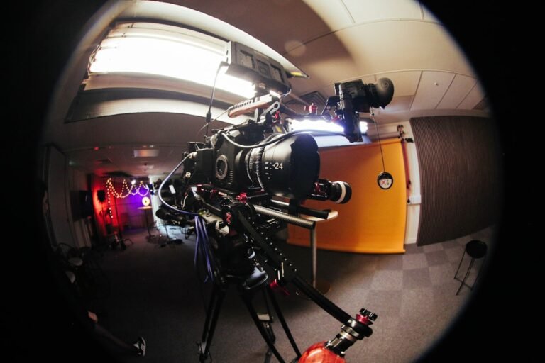 Professional video camera set up on a tripod for a film shoot