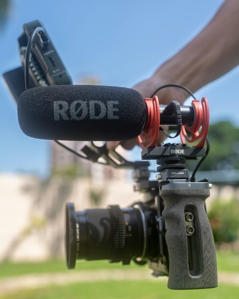 Close-up of a hand holding a camera while filming