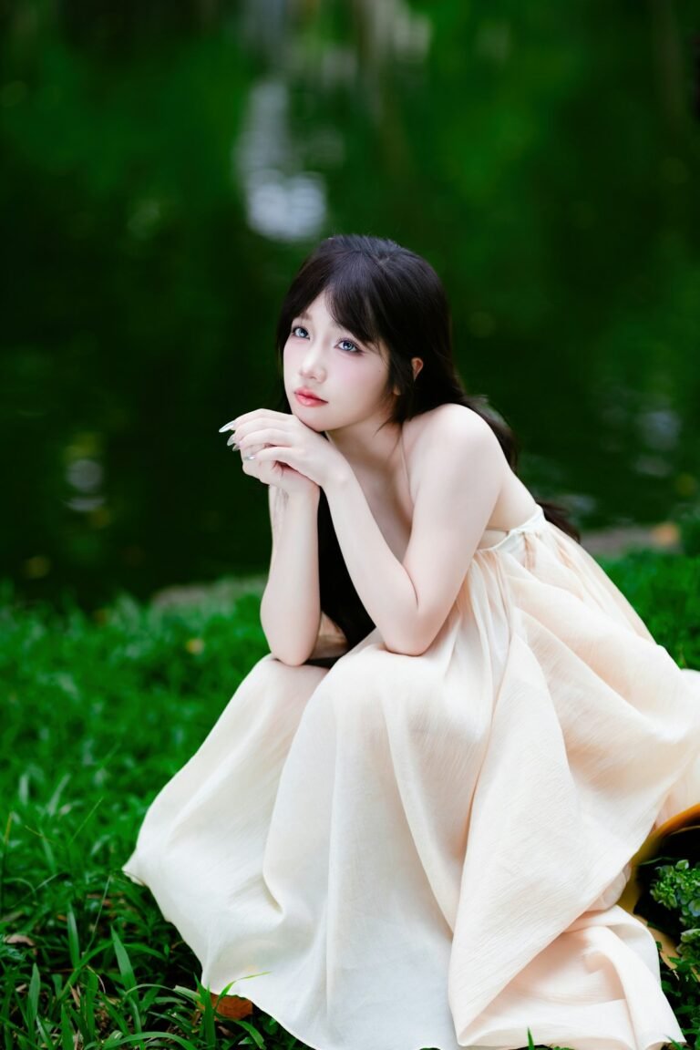 Outdoor portrait of a woman in natural light beside water